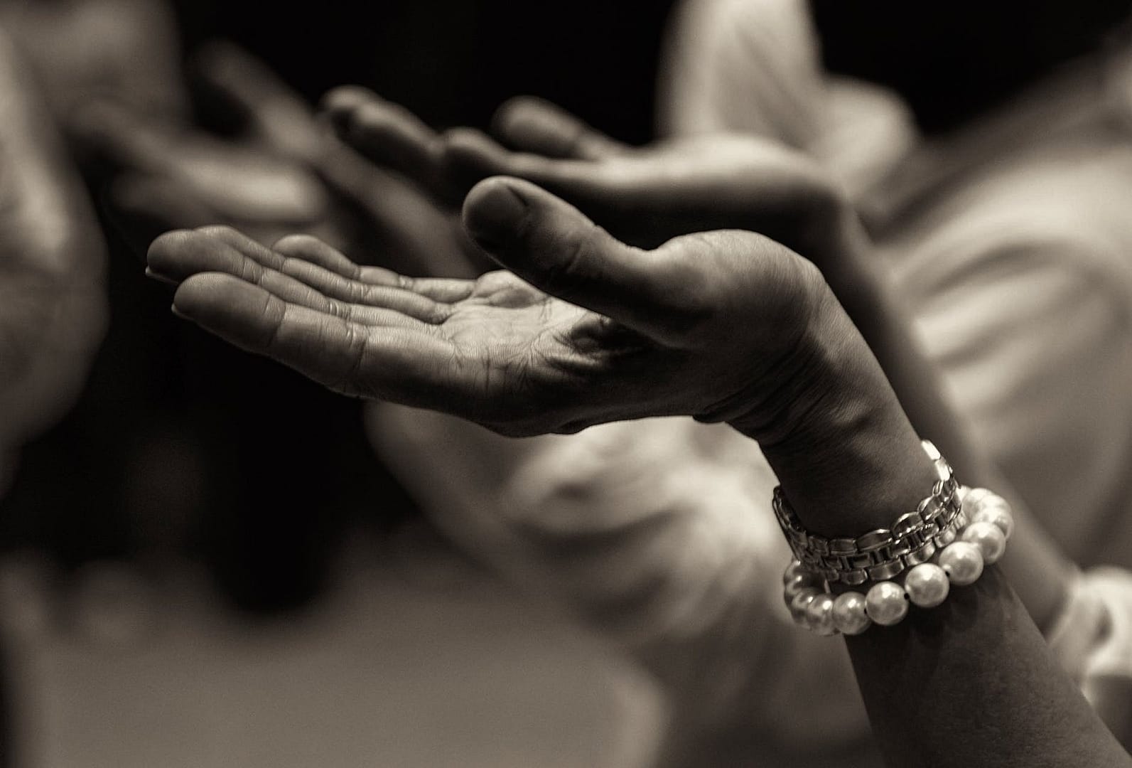close up of hands in why did god bother us?