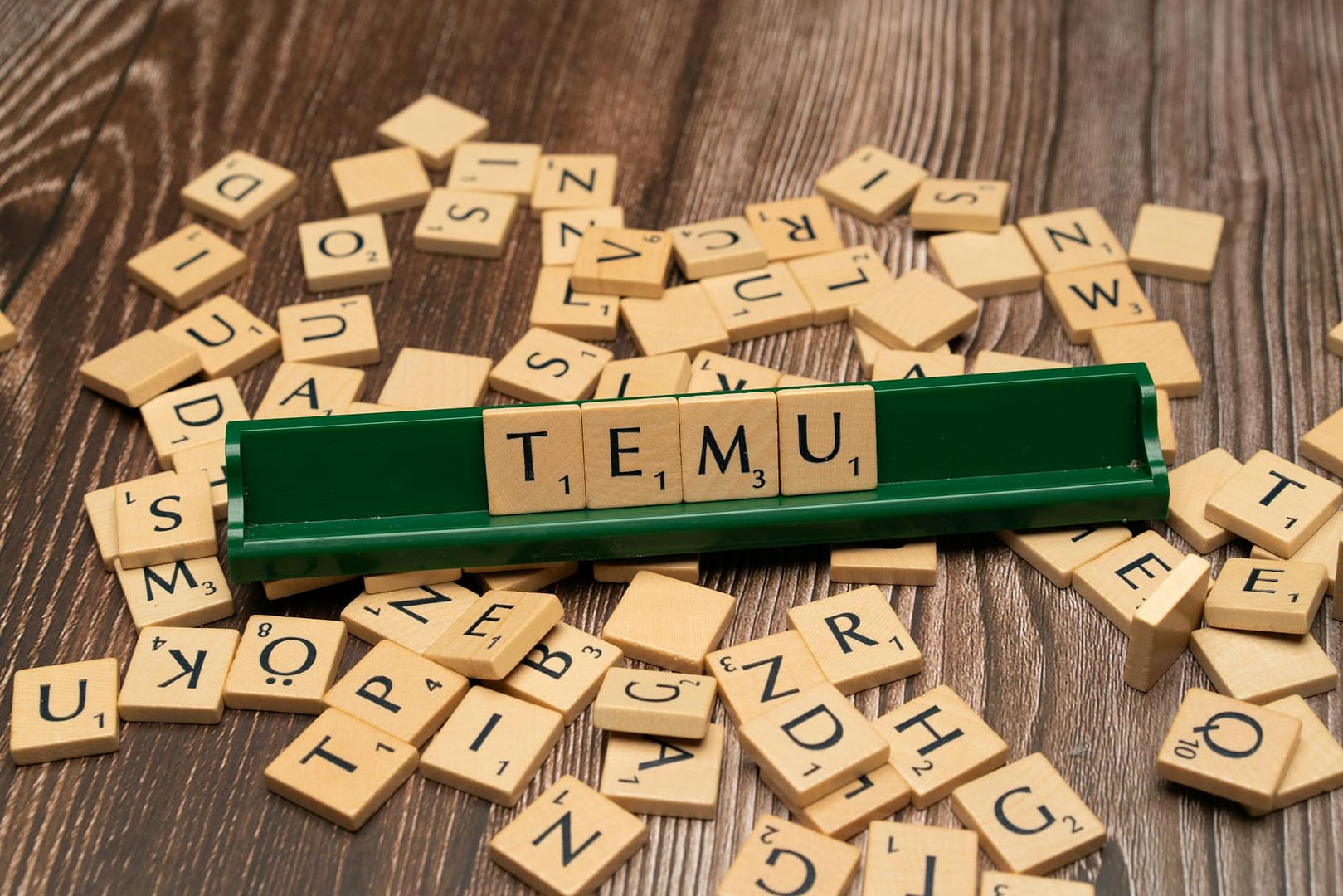 the word tiem is spelled out with scrabble tiles