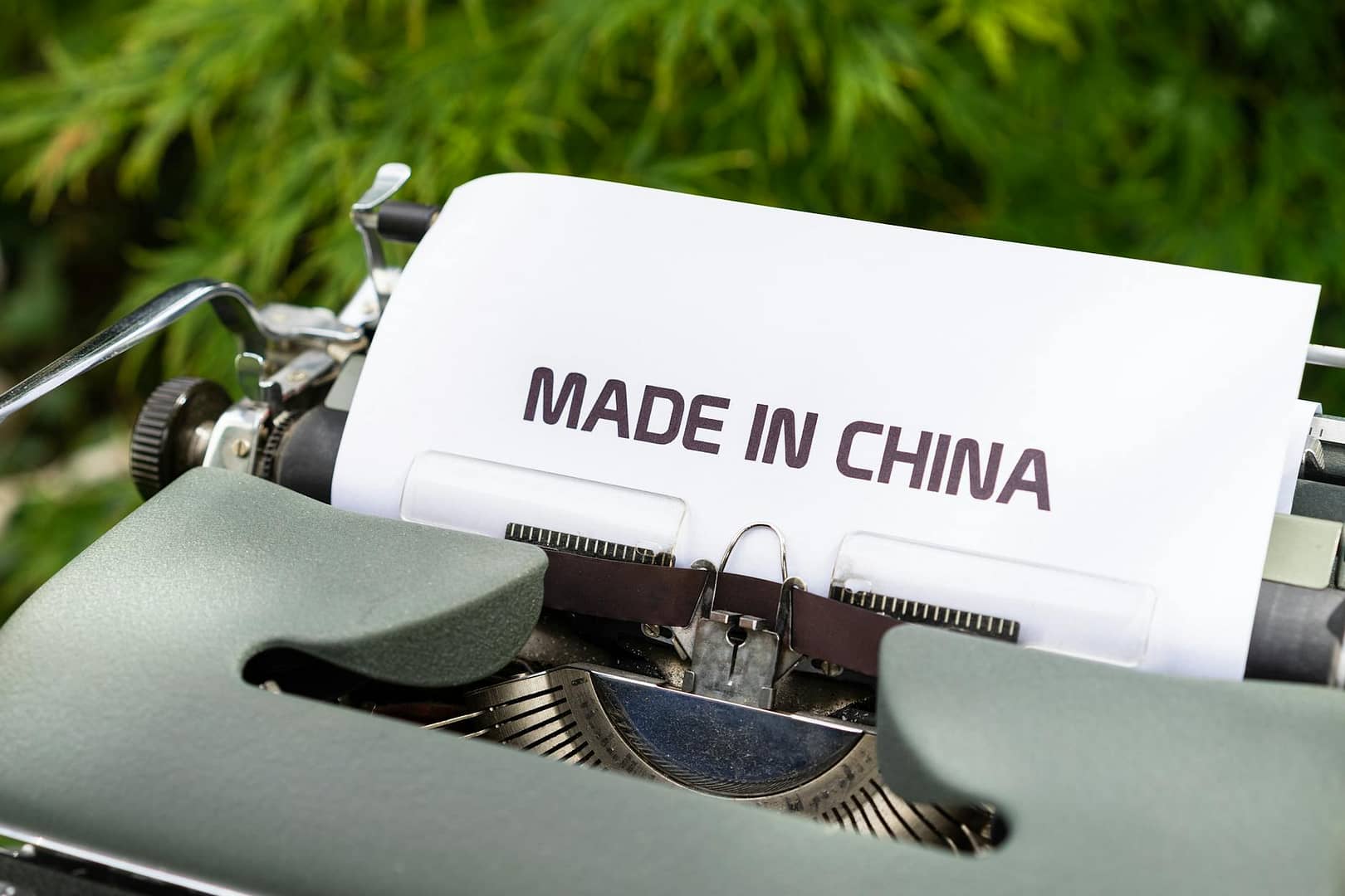 white and black typewriter on green grass
