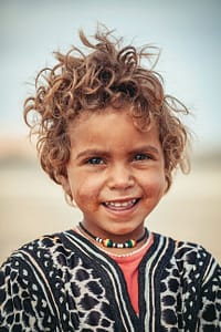 cute native australian child giving beautiful toothy smile