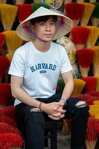 a man wearing a conical hat