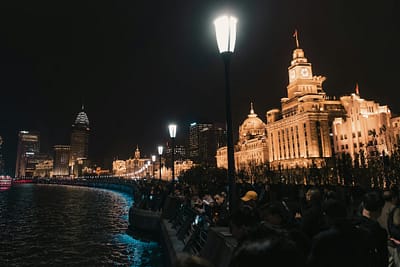 old stone custom house with shining street lanterns in shanghai